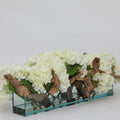 Pot de fleurs en verre Casa Moderna avec hortensias et bois flotté